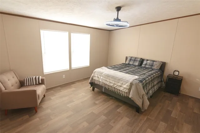 a bedroom with a bed and window