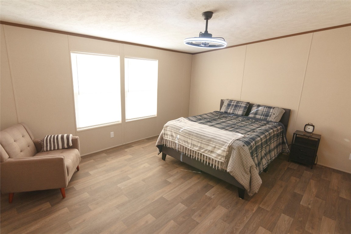 1977 Jeddo Road Rosanky, TX 78953 - Photo 9 of 30 a bedroom with a bed and window