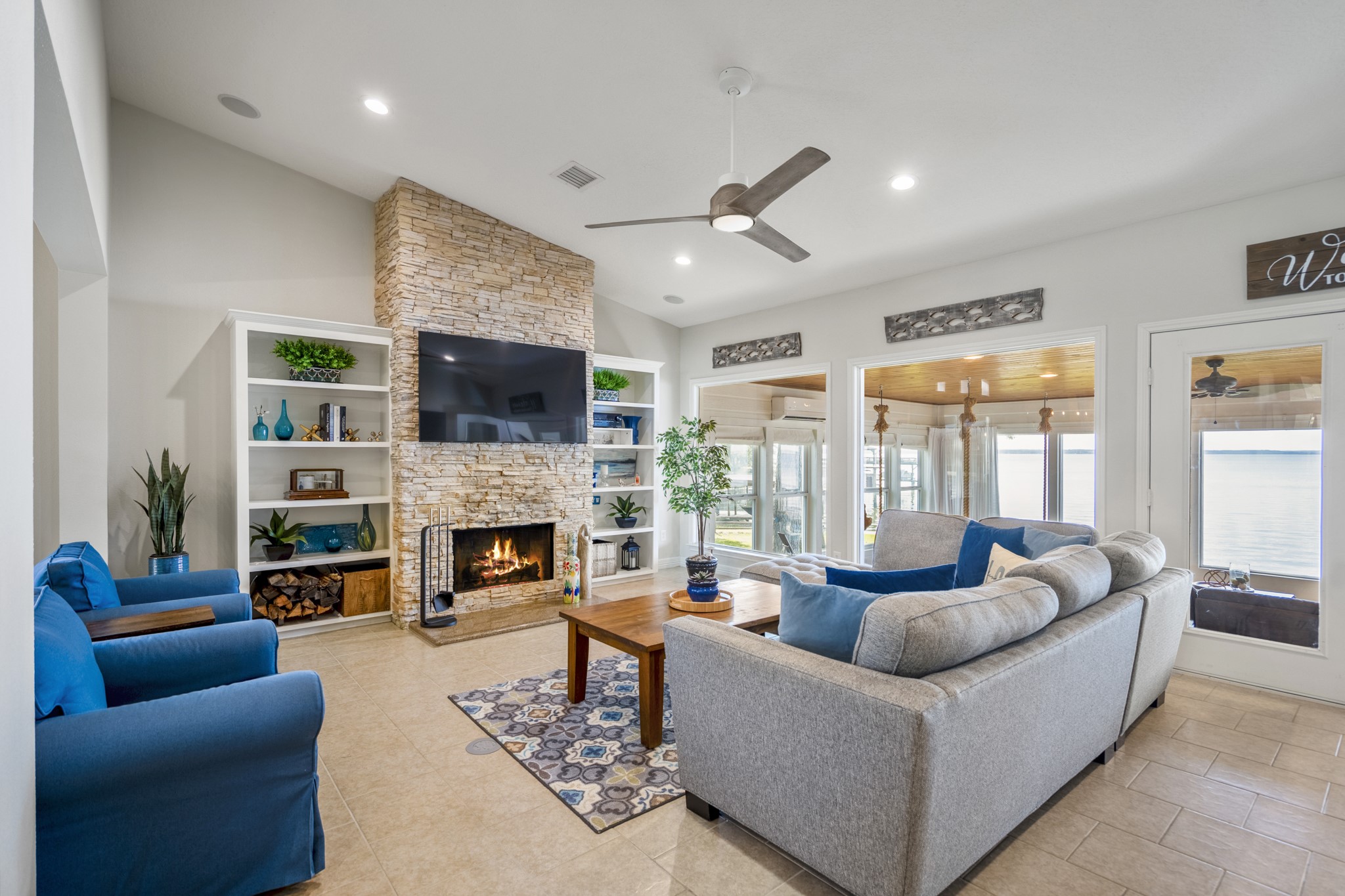 615 Inlet Drive Livingston, TX 77351 - Photo 13 of 50 a living room with furniture a fireplace and a large window