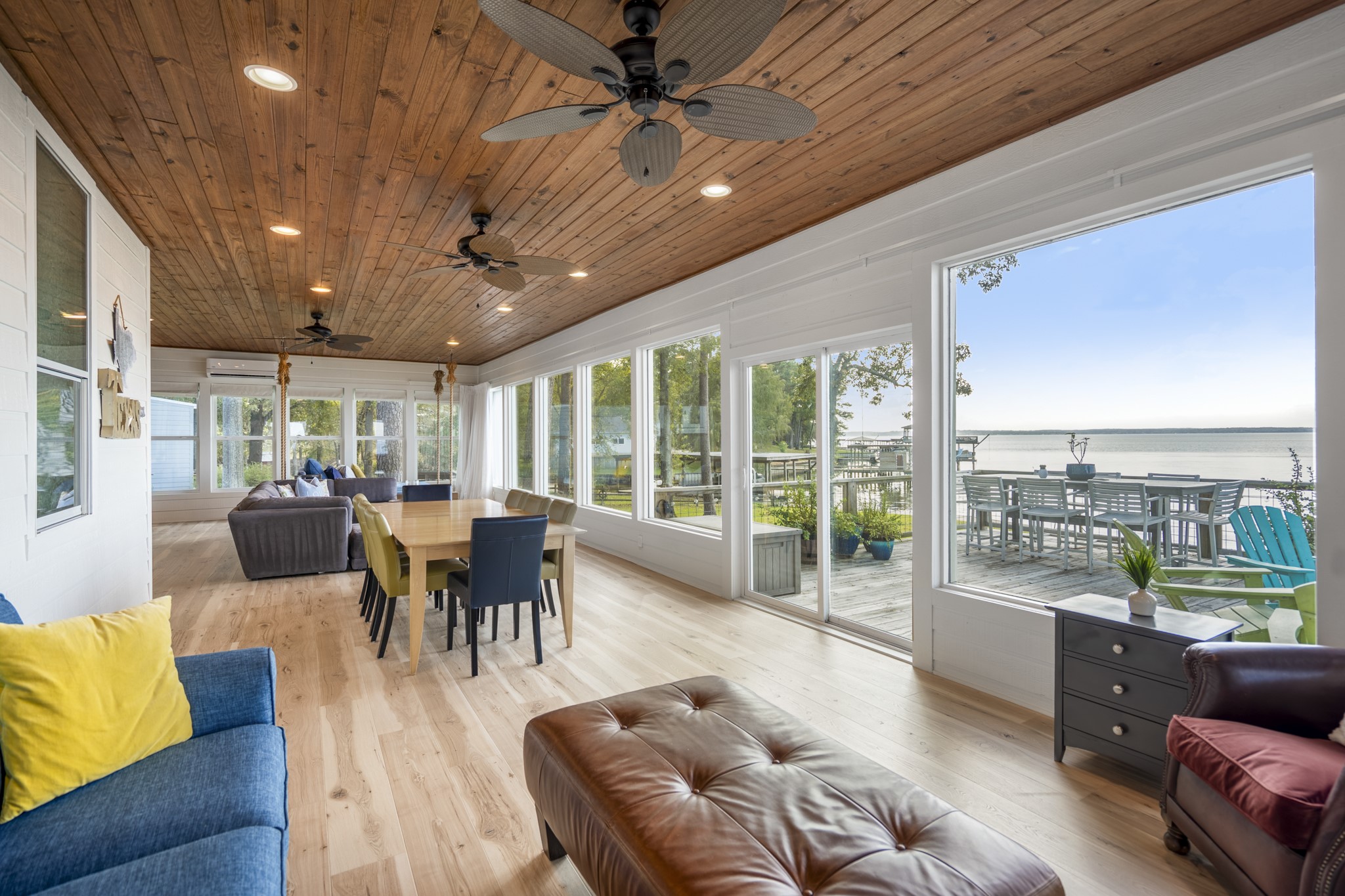 615 Inlet Drive Livingston, TX 77351 - Photo 19 of 50 a living room with furniture floor to ceiling window and wooden floor