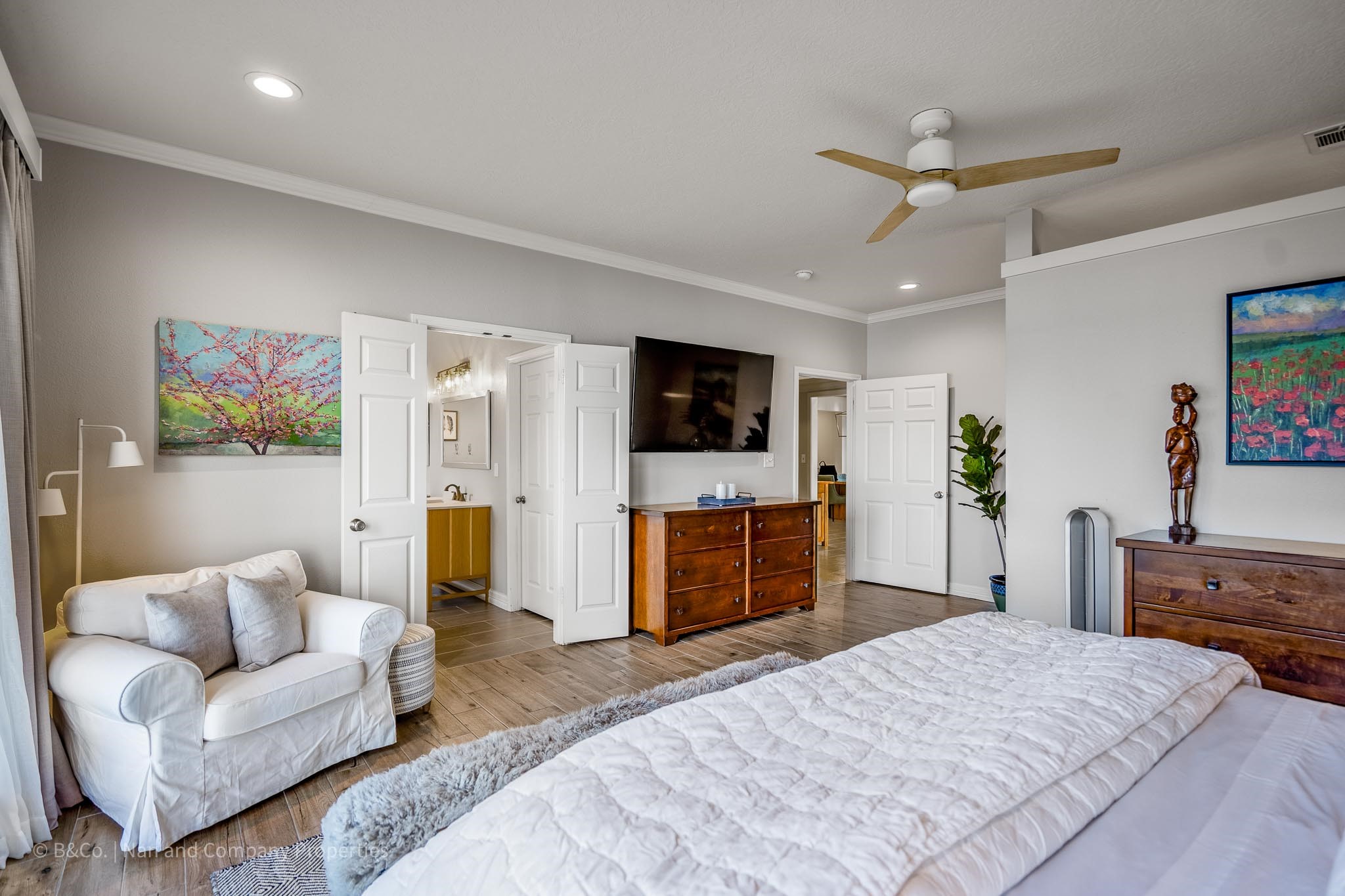 615 Inlet Drive Livingston, TX 77351 - Photo 24 of 50 The primary suite offers stunning views of the lake and tons of natural light.