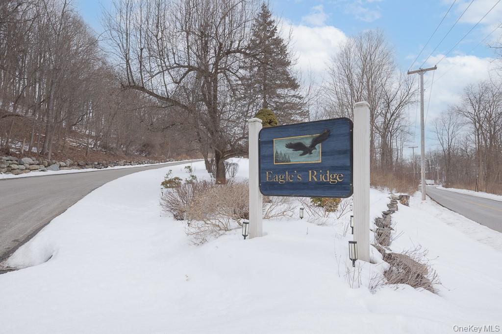 1406 Eagles Ridge Road Brewster, NY 10509 - Photo 1 of 23 a sign board with a park