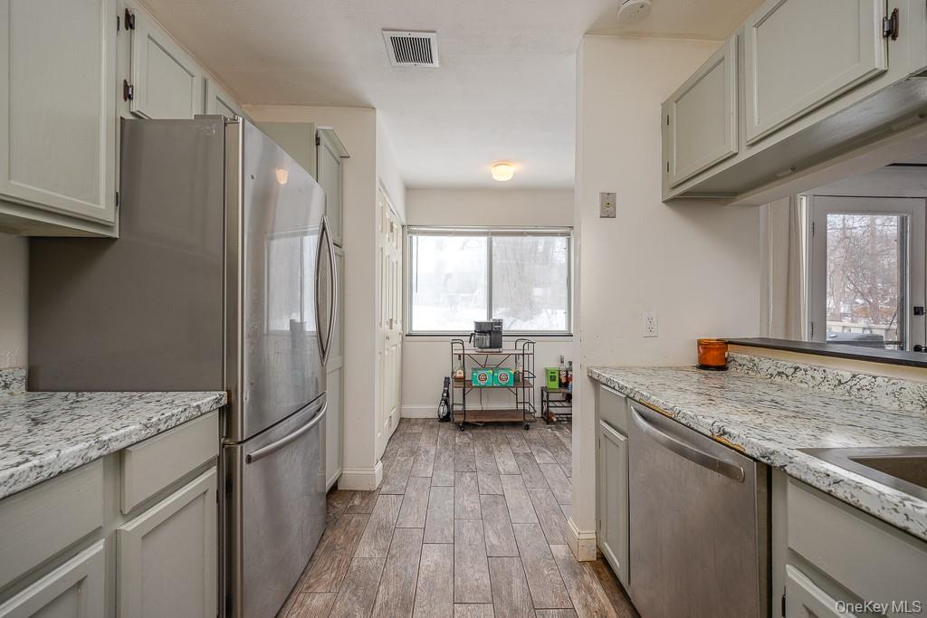 1406 Eagles Ridge Road Brewster, NY 10509 - Photo 11 of 23 a kitchen with a sink stove and refrigerator