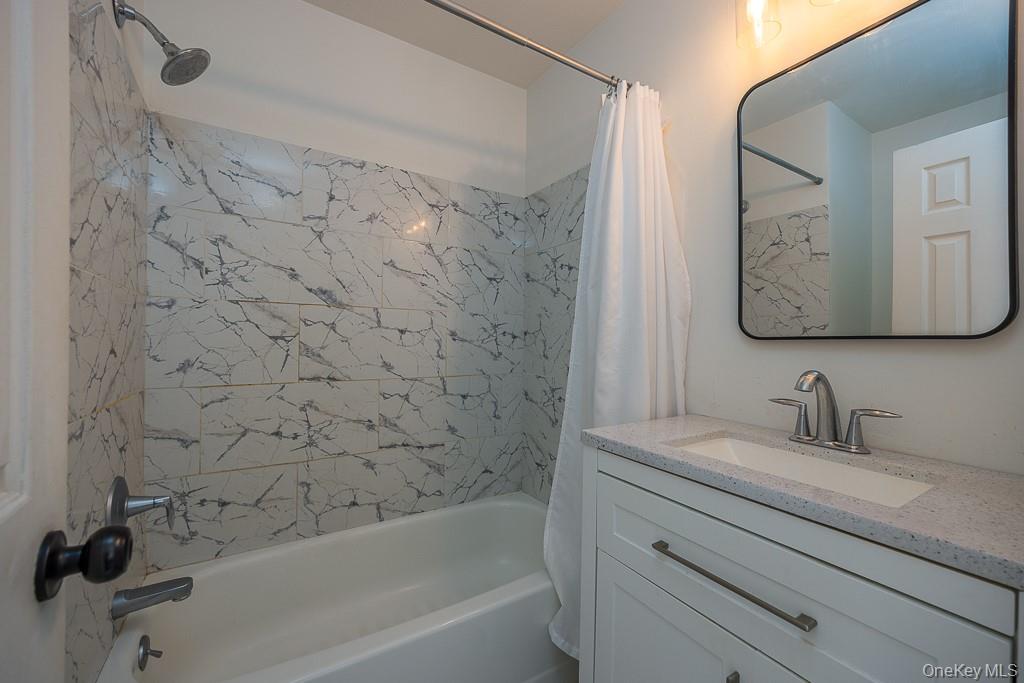 1406 Eagles Ridge Road Brewster, NY 10509 - Photo 15 of 23 a bathroom with a sink and a mirror
