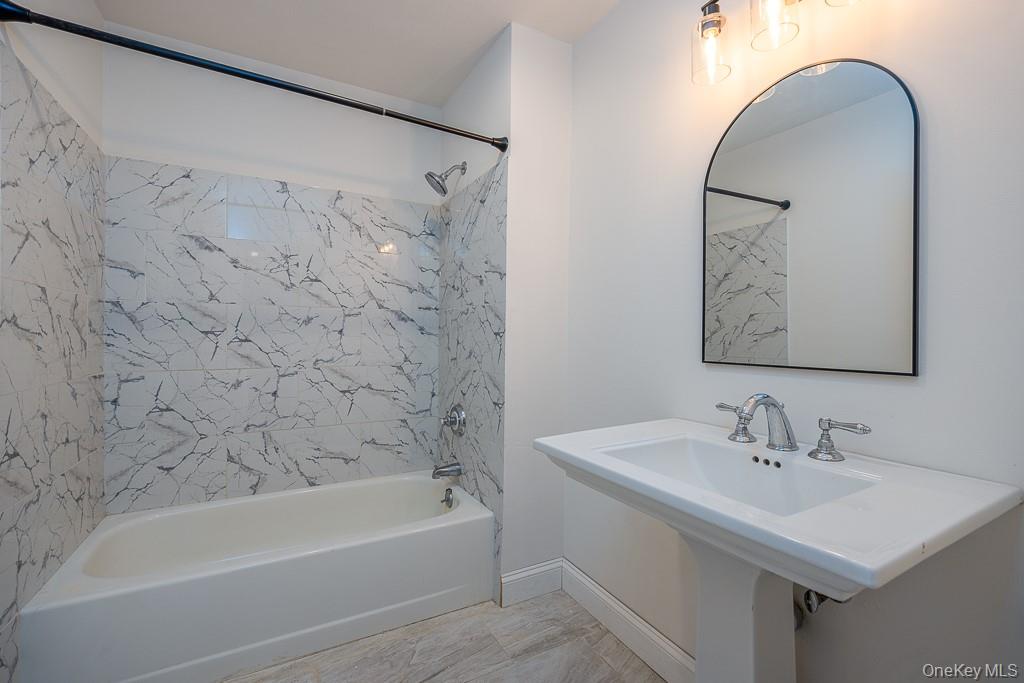 1406 Eagles Ridge Road Brewster, NY 10509 - Photo 16 of 23 a bathroom with a sink and a mirror