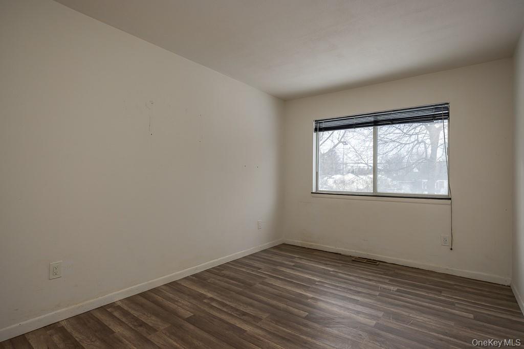 1406 Eagles Ridge Road Brewster, NY 10509 - Photo 18 of 23 wooden floor in an empty room with a window