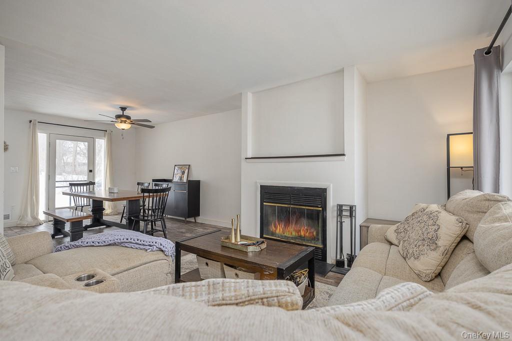 1406 Eagles Ridge Road Brewster, NY 10509 - Photo 3 of 23 a living room with furniture and a fireplace