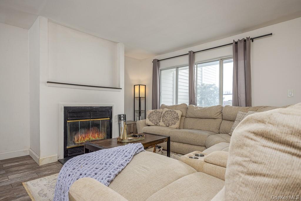1406 Eagles Ridge Road Brewster, NY 10509 - Photo 4 of 23 a living room with furniture and a fireplace
