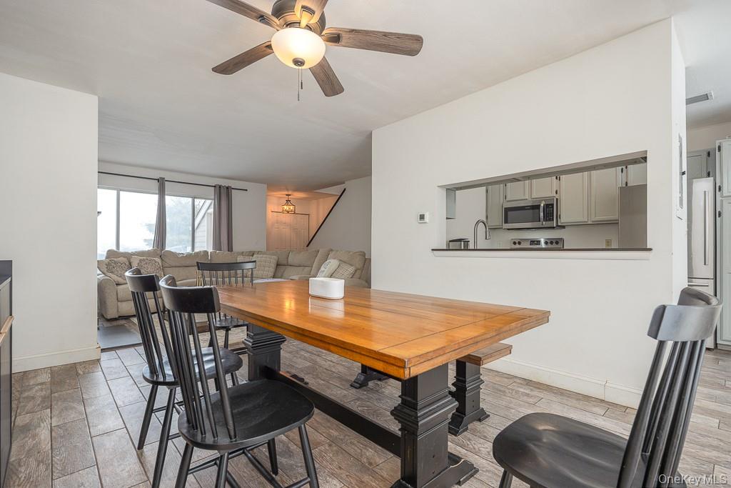 1406 Eagles Ridge Road Brewster, NY 10509 - Photo 6 of 23 a view of a dining room with furniture and a chandelier