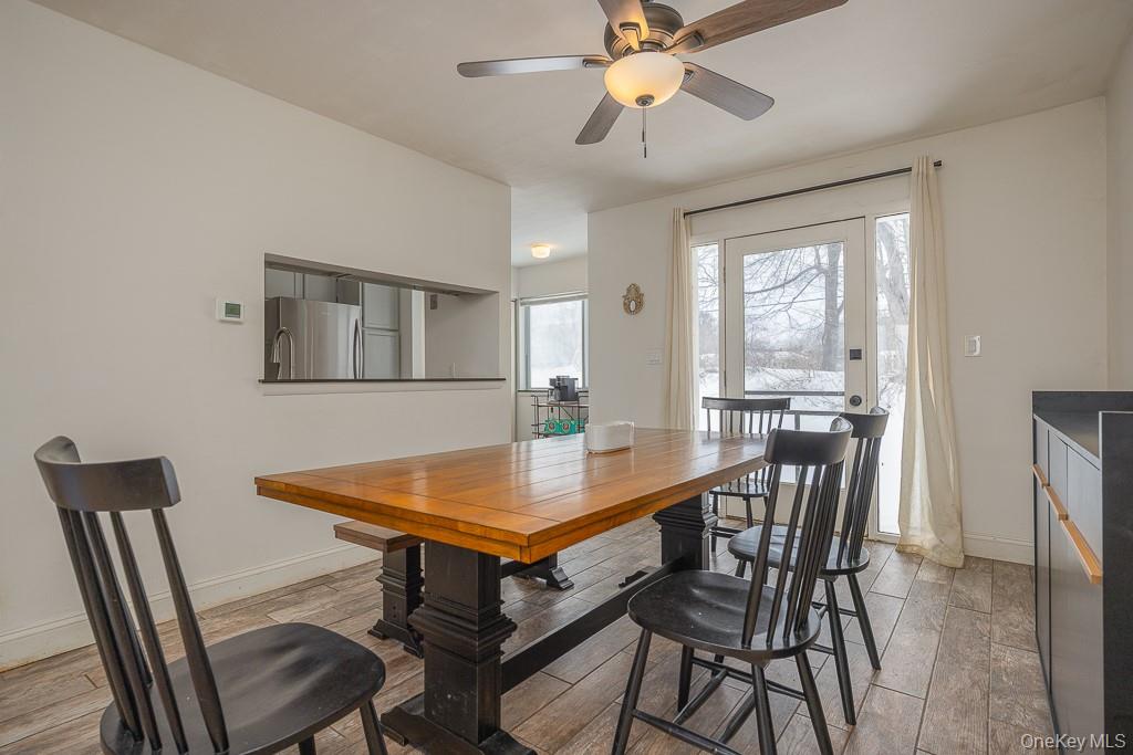 1406 Eagles Ridge Road Brewster, NY 10509 - Photo 7 of 23 a view of a dining room with furniture and a chandelier