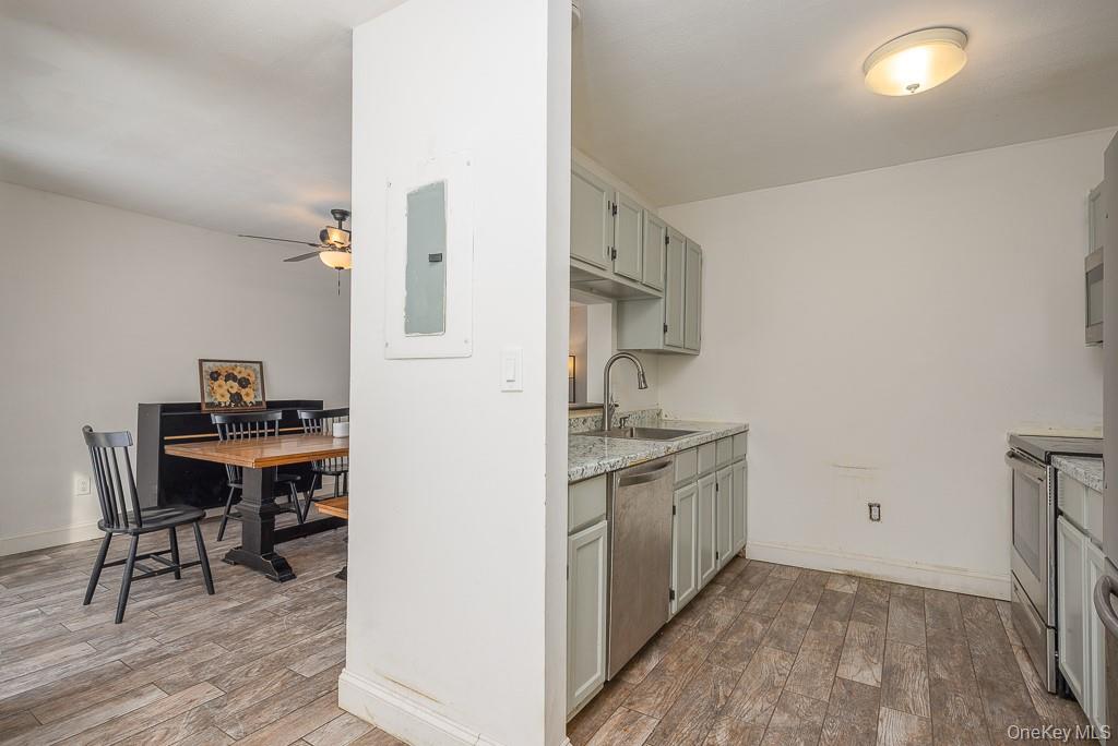 1406 Eagles Ridge Road Brewster, NY 10509 - Photo 8 of 23 a kitchen with stainless steel appliances granite countertop a stove and a refrigerator