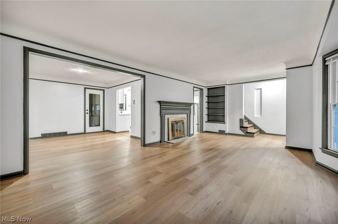 1352 Ford Road Lyndhurst, OH 44124 - Photo 17 of 48 Unfurnished living room with built in features and light hardwood / wood-style floors