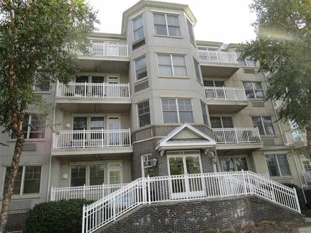 a front view of a building with a lot of windows