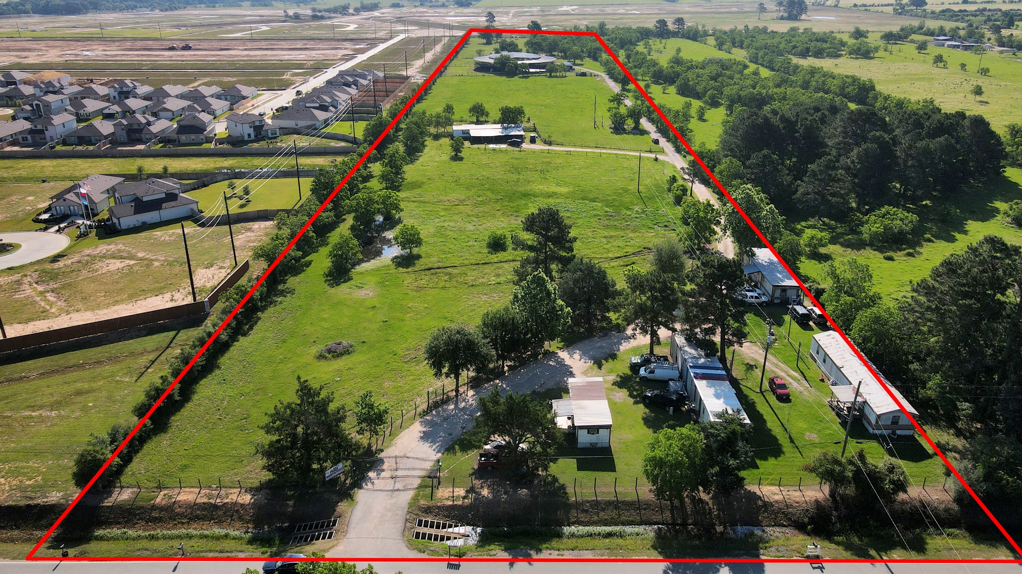 a view of swimming pool with a garden and plants