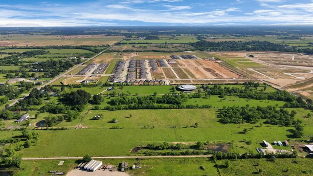 an aerial view of a residential houses and outdoor space
