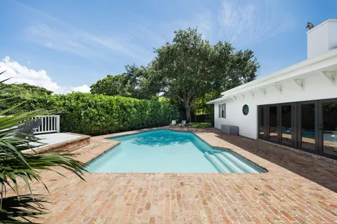 a view of a backyard of the house