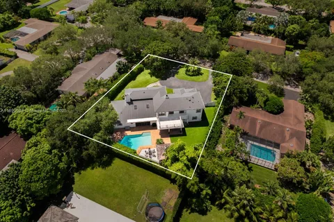 an aerial view of house with a yard