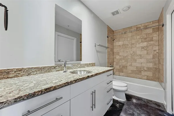 a kitchen with stainless steel appliances a stove sink and microwave