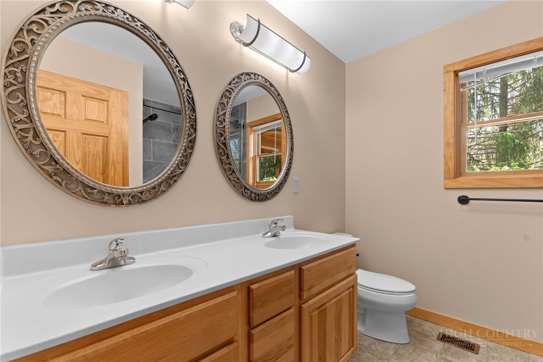 148 Woodby Ridge Road Vilas, NC 28692 - Photo 19 of 33 a bathroom with a sink and a mirror