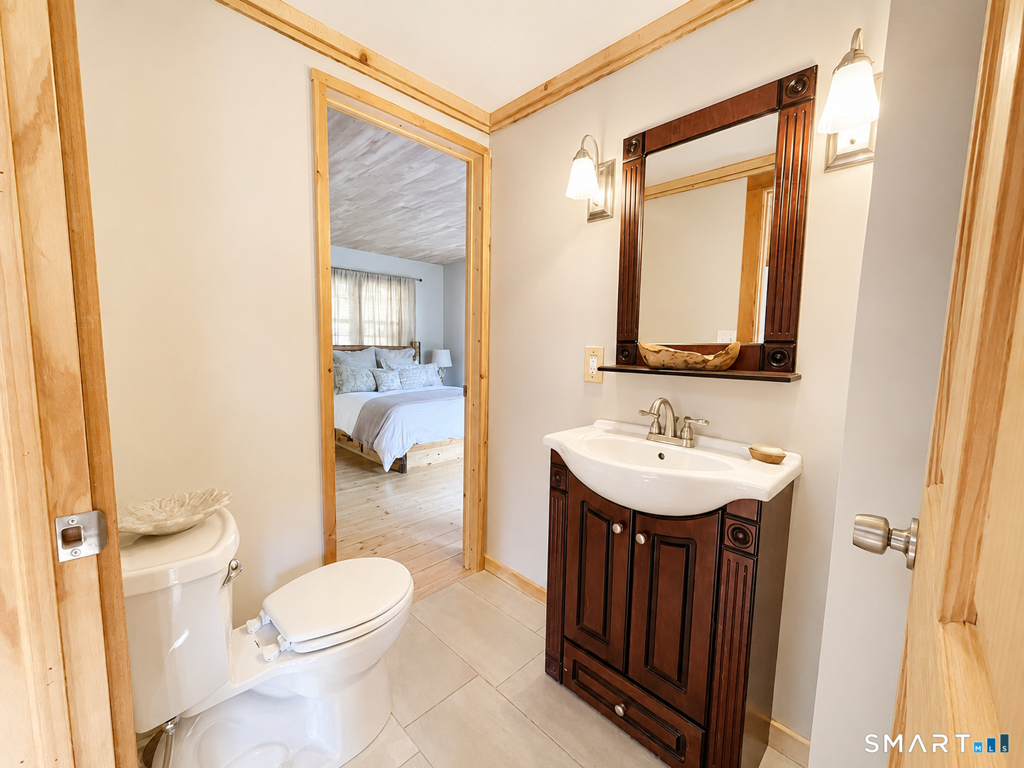 74 Cove Road, Unit 17 Haddam, CT 06424 - Photo 10 of 39 a bathroom with a toilet a sink a mirror and a shower