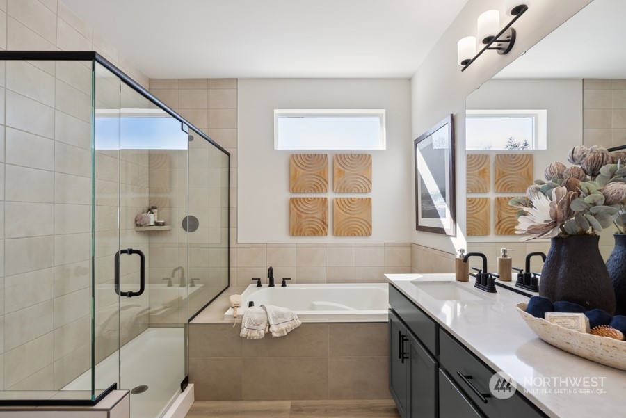 4034 Aberdeen Way Northeast, Unit 35 Renton, WA 98056 - Photo 17 of 32 a bathroom with a tub sink and mirror