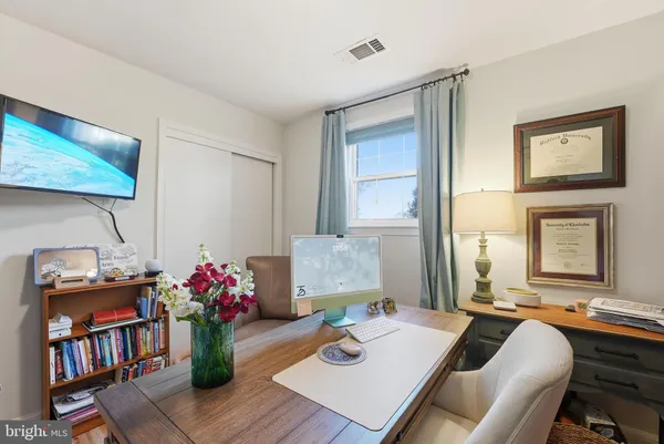 a view of a workspace with furniture