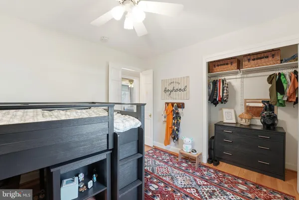 a living room with furniture and a dresser