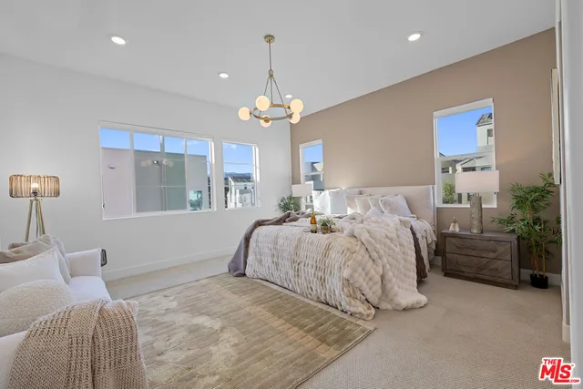 a bathroom with double sink and a mirror