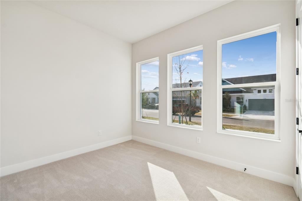 31479 Hayman Loop Wesley Chapel, FL 33545 - Photo 24 of 45 a view of an empty room with a window