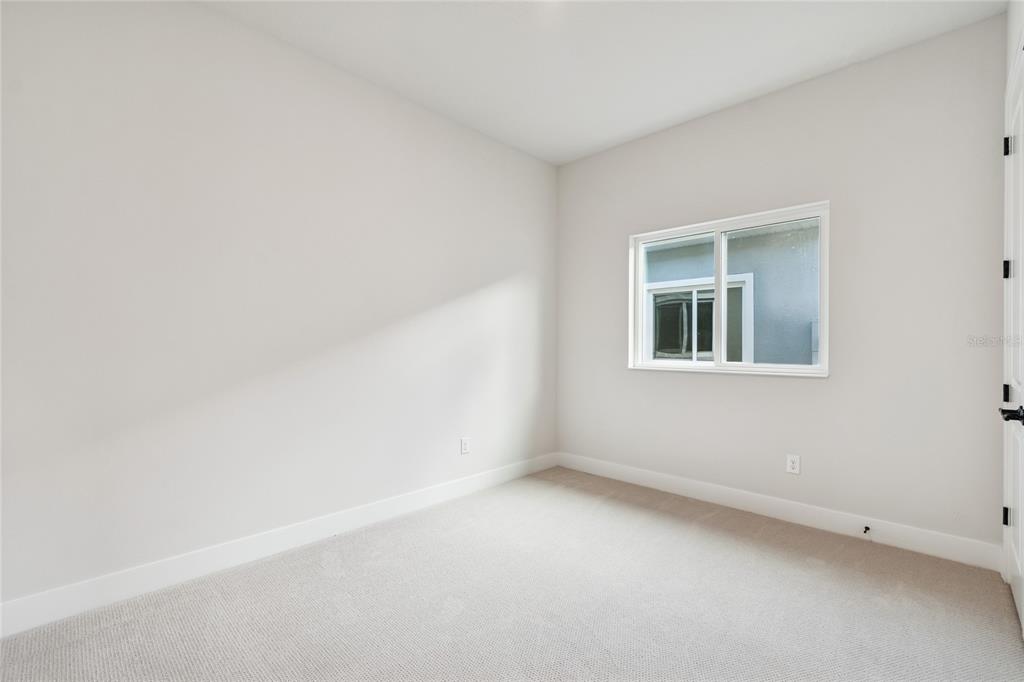 31479 Hayman Loop Wesley Chapel, FL 33545 - Photo 28 of 45 an empty room with a window
