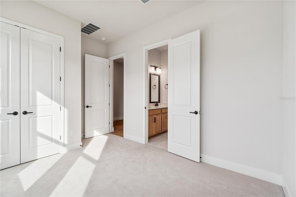 31479 Hayman Loop Wesley Chapel, FL 33545 - Photo 29 of 45 a view of a bathroom with a shower and a sink