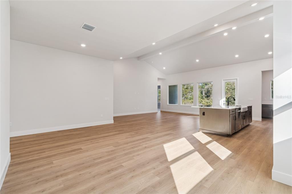 31479 Hayman Loop Wesley Chapel, FL 33545 - Photo 9 of 45 a living room with furniture and a large window