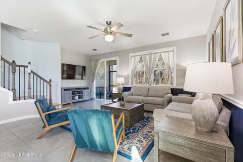 a living room with furniture and a flat screen tv