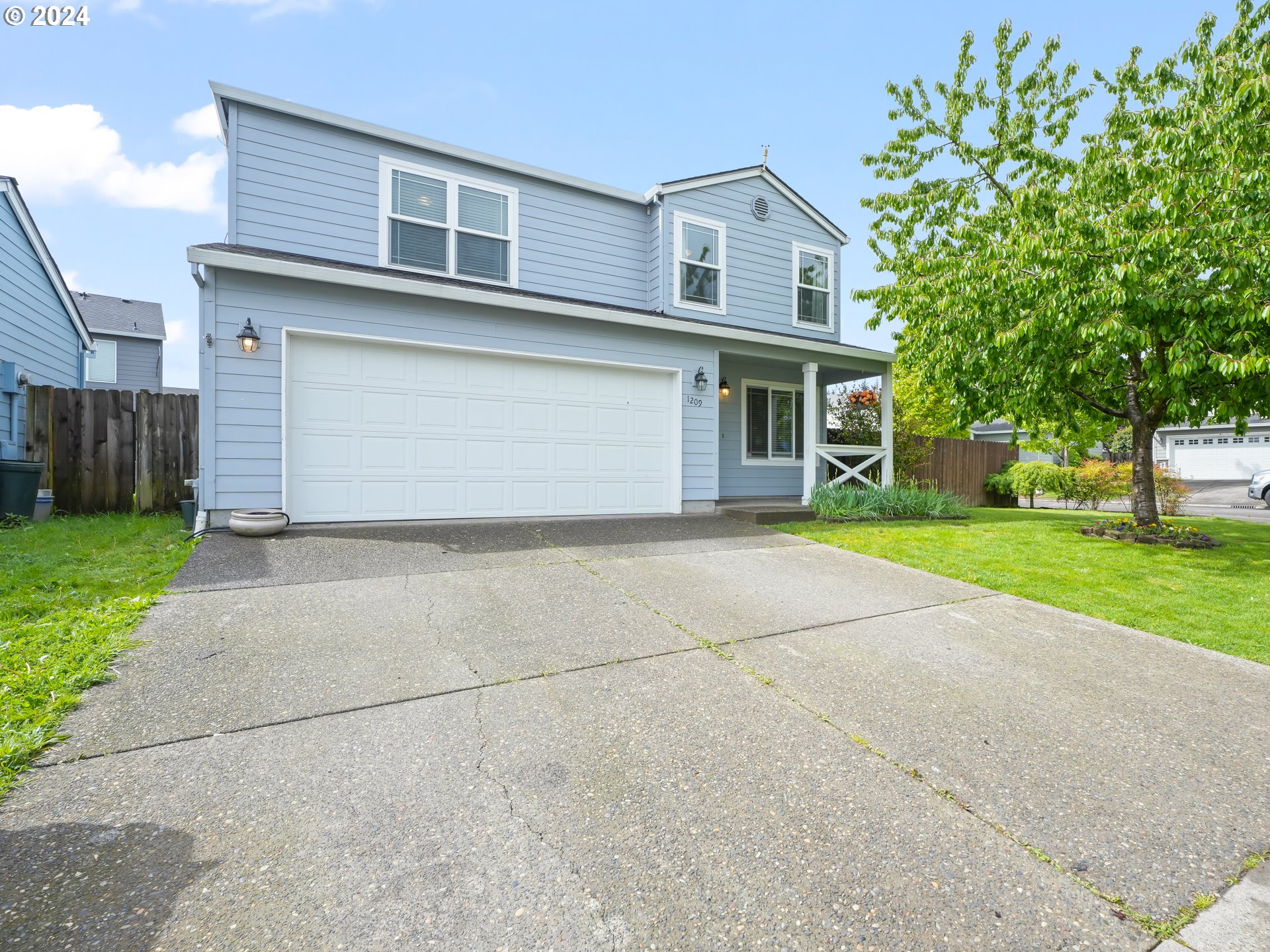 1209 Northeast 167th Street Ridgefield, WA 98642 - Photo 3 of 38 a front view of house with yard and green space