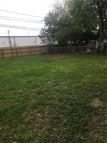 a view of a backyard of the house