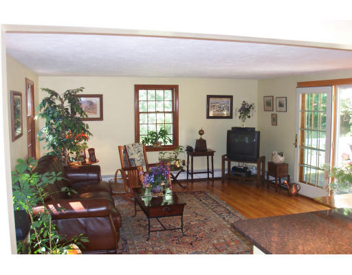78 Dudley Road Sudbury, MA 01776 - Photo 2 of 7 a living room with furniture and a flat screen tv