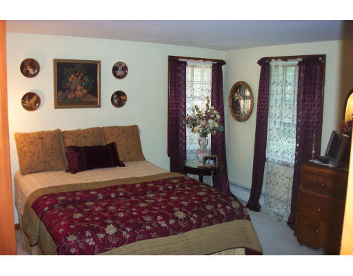 78 Dudley Road Sudbury, MA 01776 - Photo 5 of 7 a bedroom with a bed and a window