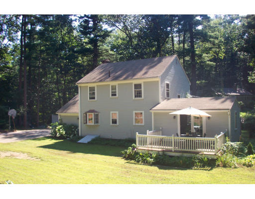 78 Dudley Road Sudbury, MA 01776 - Photo 7 of 7 a front view of a house with a yard