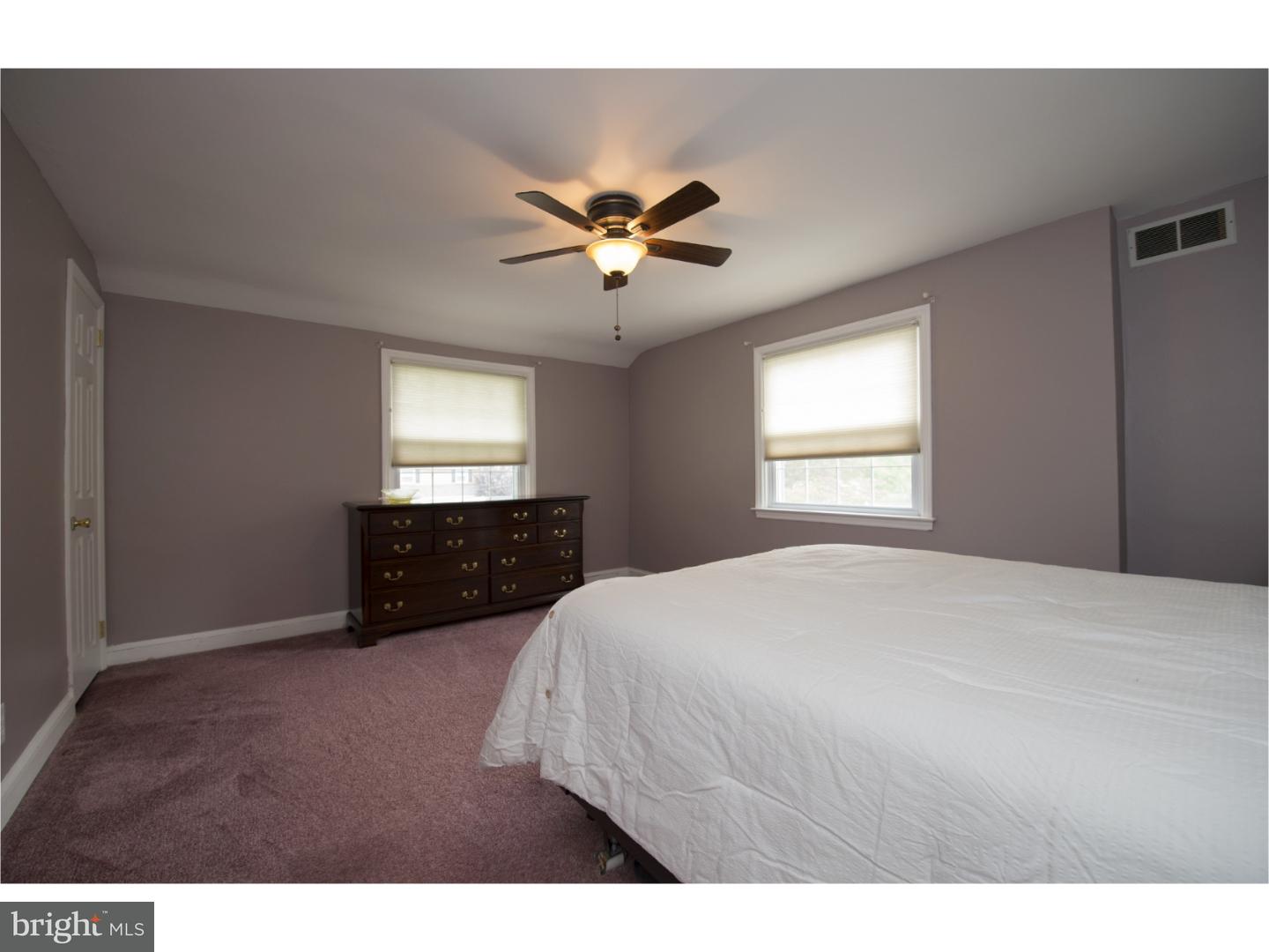 534 Kent Road Springfield, PA 19064 - Photo 13 of 24 a bedroom with a bed and a chandelier