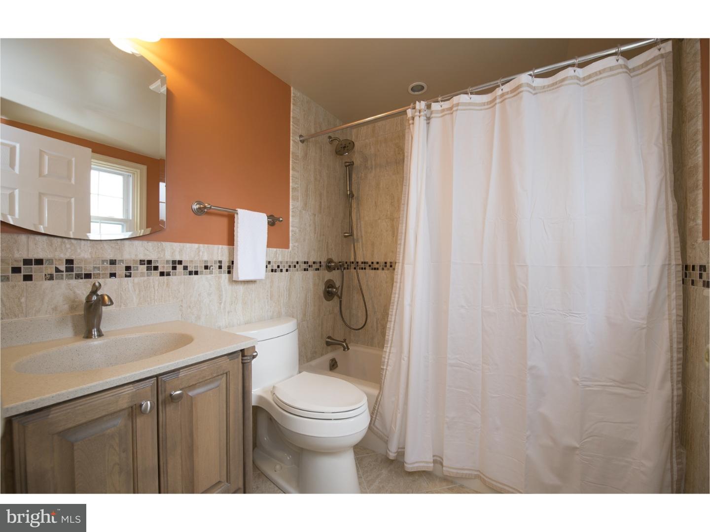 534 Kent Road Springfield, PA 19064 - Photo 15 of 24 a bathroom with a sink a toilet and shower
