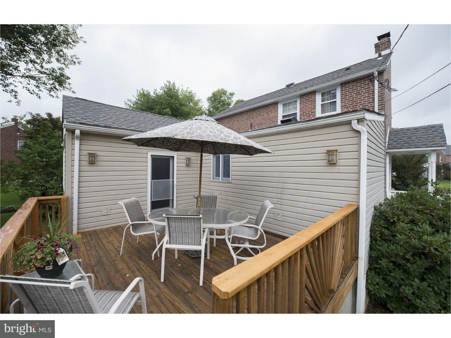 534 Kent Road Springfield, PA 19064 - Photo 20 of 24 a view of a patio with table and chairs with wooden floor and fence
