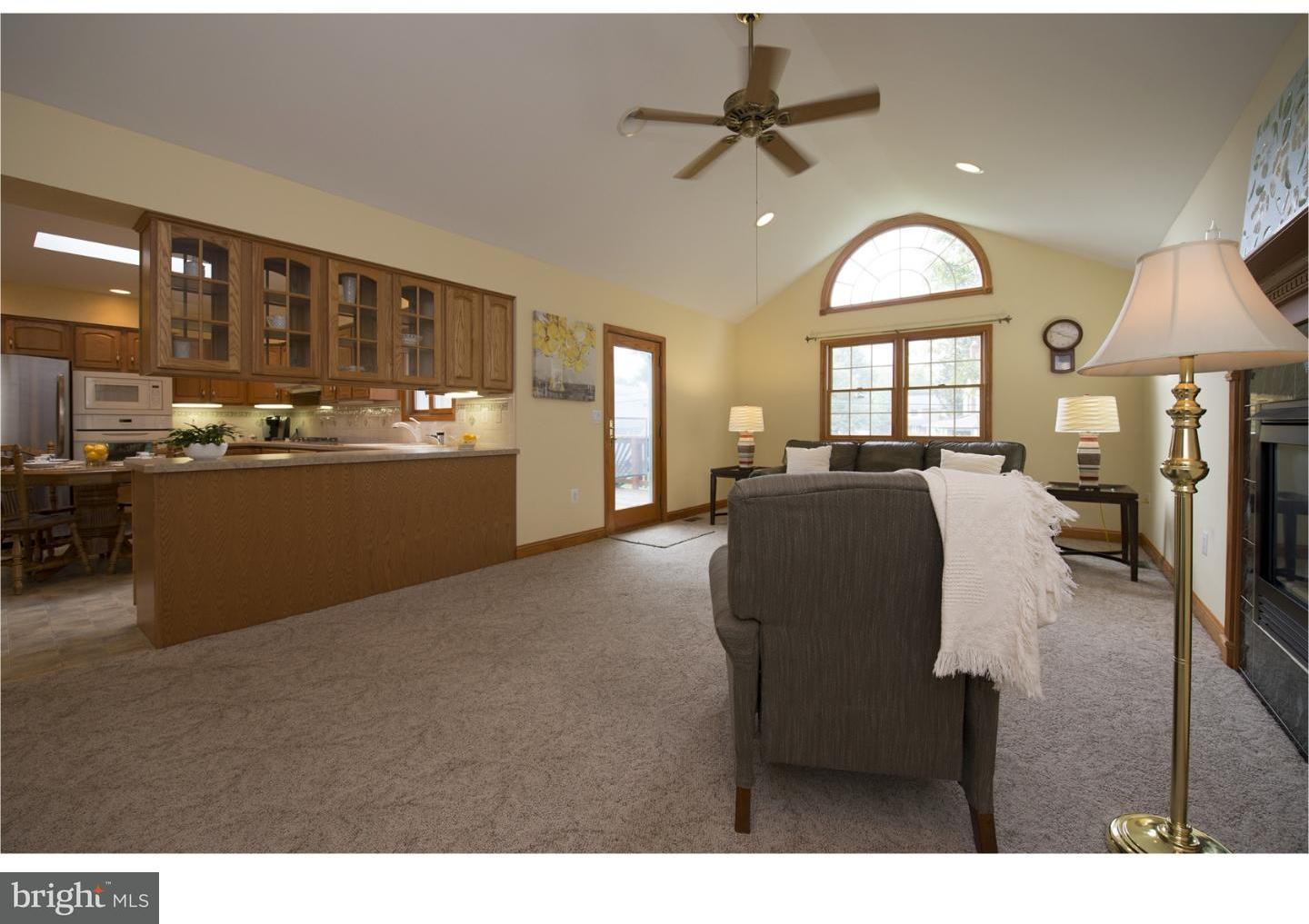 534 Kent Road Springfield, PA 19064 - Photo 7 of 24 a living room with stainless steel appliances kitchen island granite countertop furniture and a large window