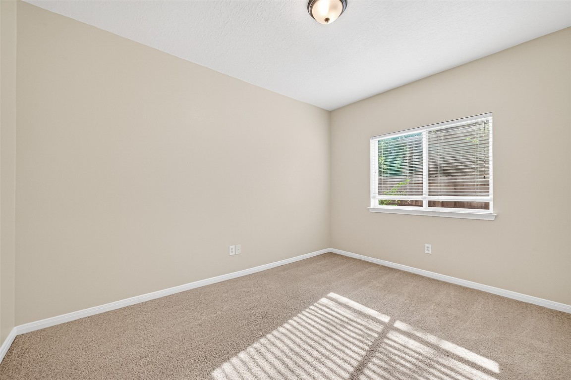 1514 Melissa Drive Spring, TX 77386 - Photo 14 of 20 The other secondary bedroom also has new carpet and new light fixtrues.