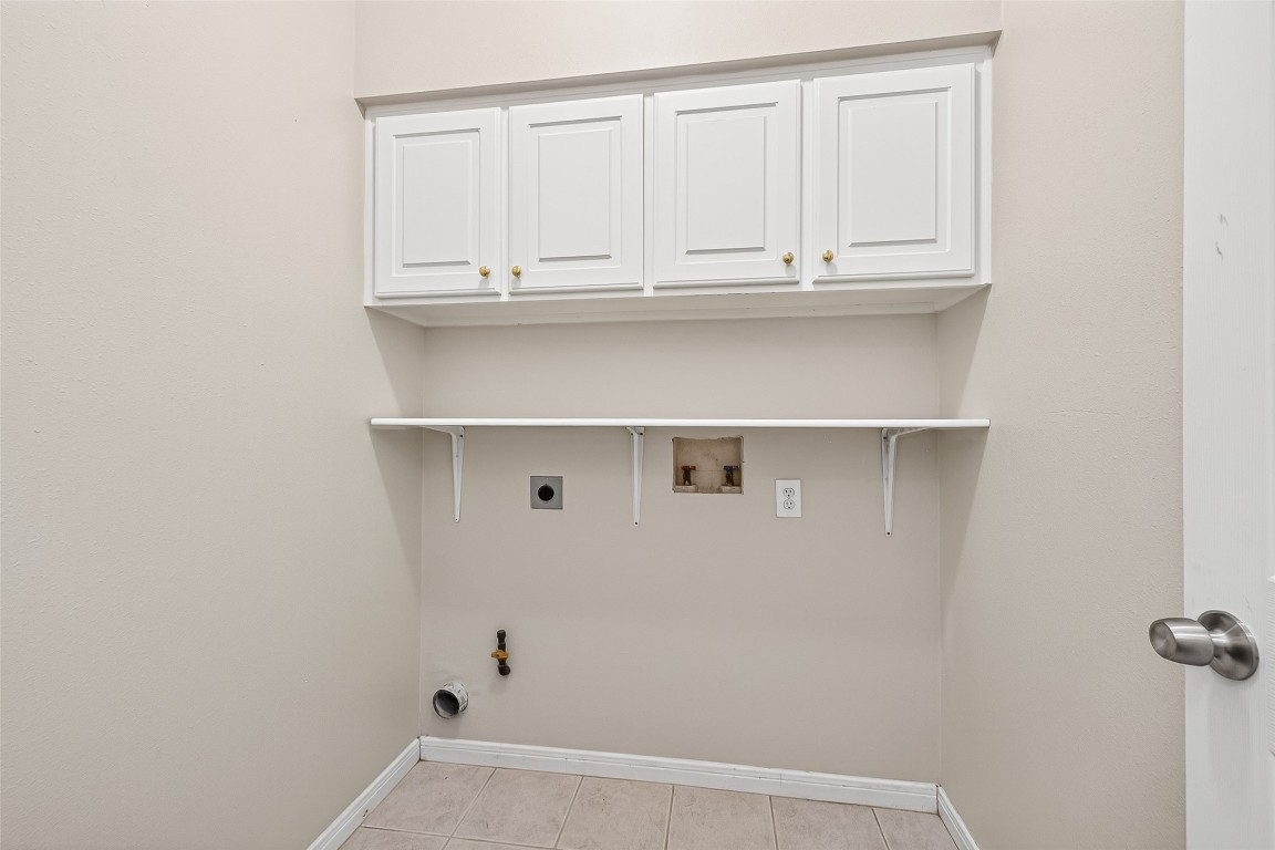 1514 Melissa Drive Spring, TX 77386 - Photo 15 of 20 The laundry room is conveniently located and has connections for both an electric or gas dryer.