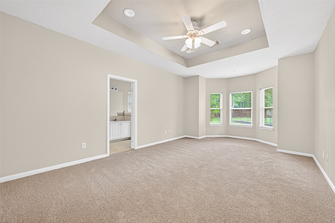 1514 Melissa Drive Spring, TX 77386 - Photo 16 of 20 The master bedroom has trayed ceiling, new carpet and new fixtures.