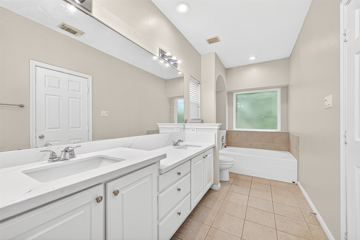 1514 Melissa Drive Spring, TX 77386 - Photo 18 of 20 The master has a garden tub and a shower.