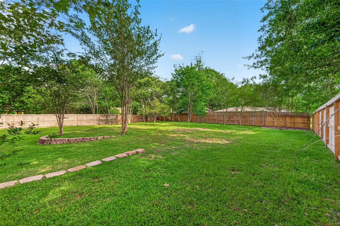 1514 Melissa Drive Spring, TX 77386 - Photo 20 of 20 What a dream of a yard! Enjoy as is or add a pool, or work-shop. The room is there. Large swinging gate offers convenient access to the back yard.