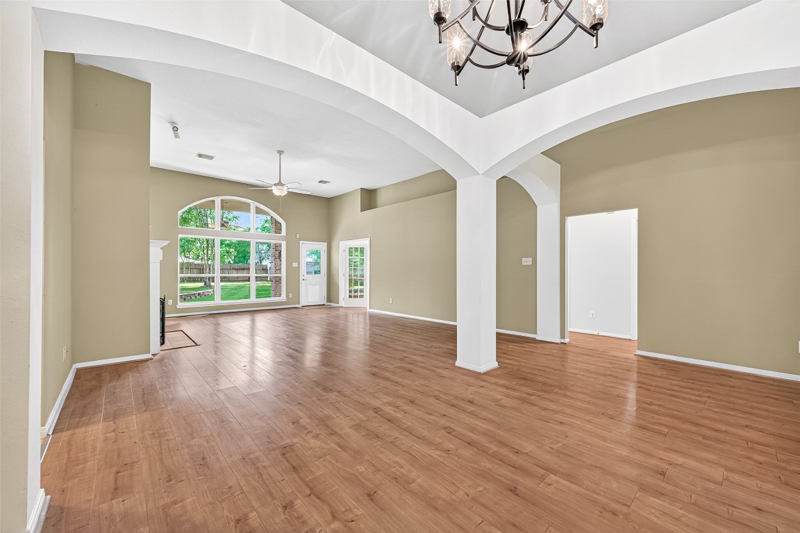 1514 Melissa Drive Spring, TX 77386 - Photo 2 of 20 High ceiling welcome you to the family room/dining room area. The open and bright areas are separated by decorative arcs.