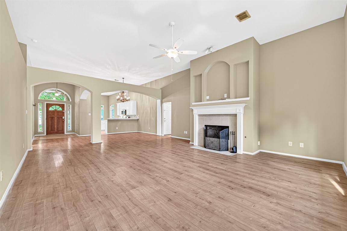 1514 Melissa Drive Spring, TX 77386 - Photo 5 of 20 A gas fireplace with usable nooks centers the family room.