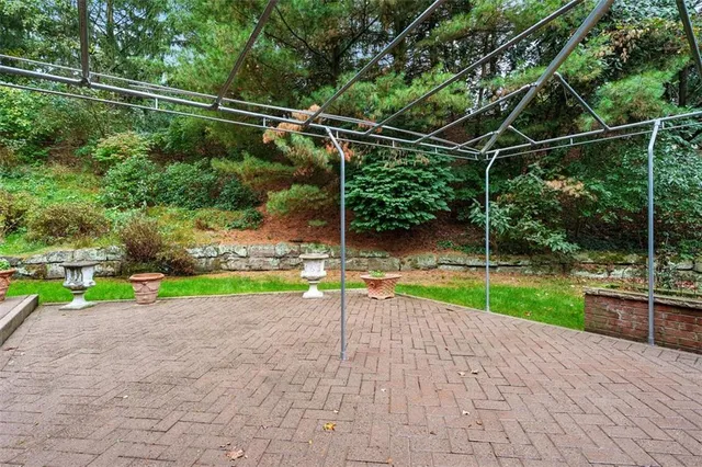 a view of a patio with chairs and a table